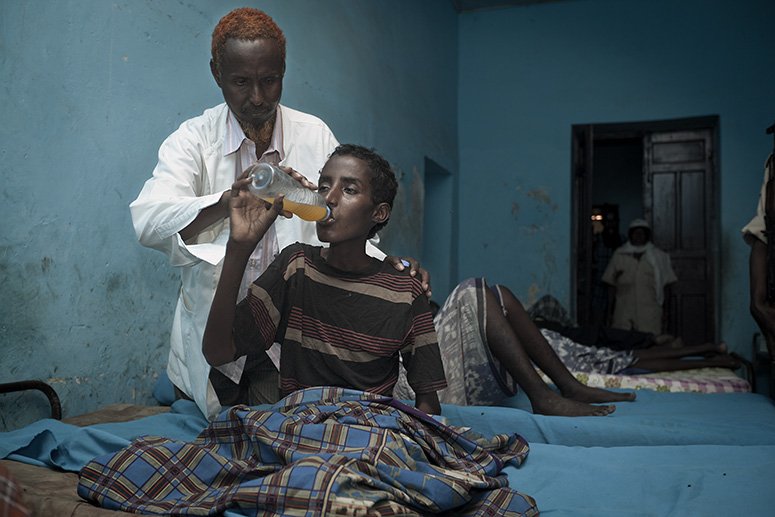 'Dr' Abdi Rahman Ali Alwa Habeeb treating an in-patient at the Habeeb Public Mental Health Clinic in Mogadishu, Somalia.